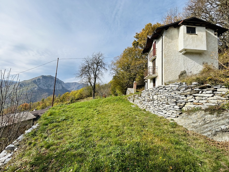 Detached house with land and stone farmhouse.