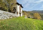 Detached house with land and stone farmhouse.