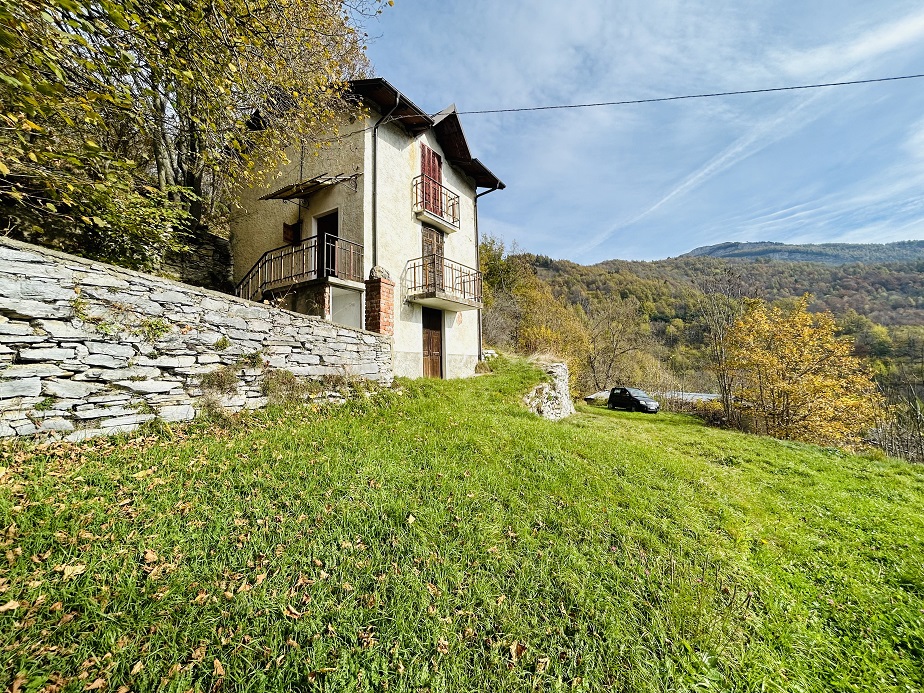 Detached house with land and stone farmhouse.