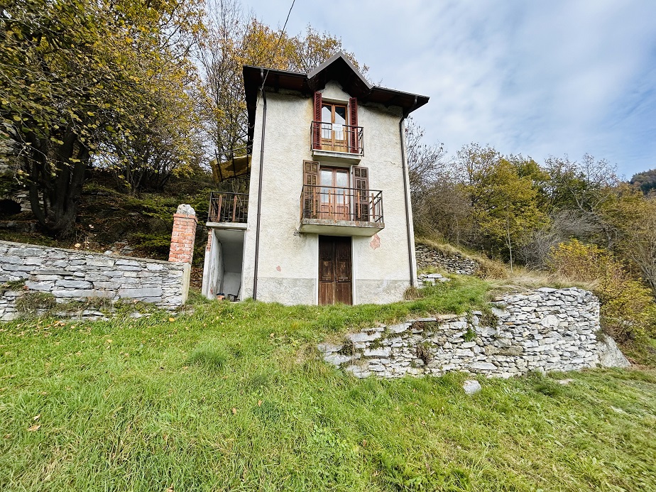 Detached house with land and stone farmhouse.