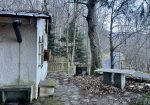 Detached house with garden and woods.