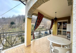 Large semi-detached villa with surrounding land.