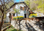 Detached villa with surrounding land.