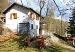 Detached villa with surrounding land.