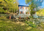 Detached villa with surrounding land.
