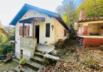Detached villa with surrounding land.