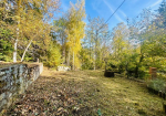 Detached villa with surrounding land.