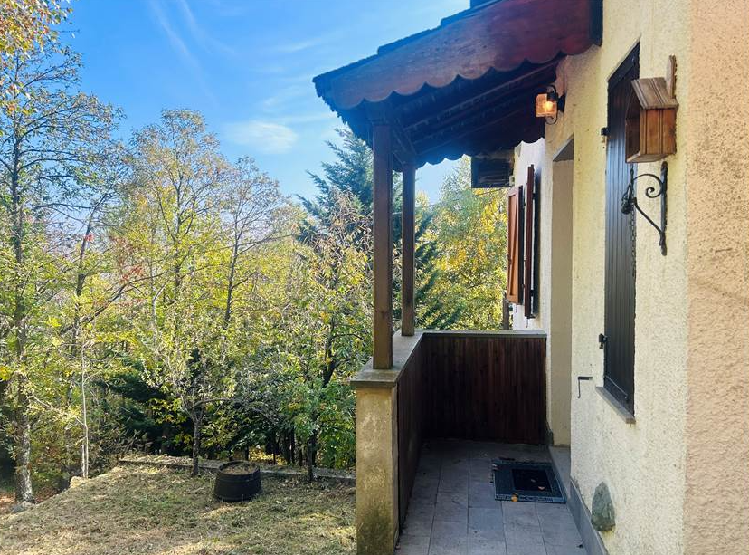 Detached villa with surrounding land.