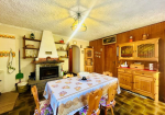 Detached villa with surrounding land.