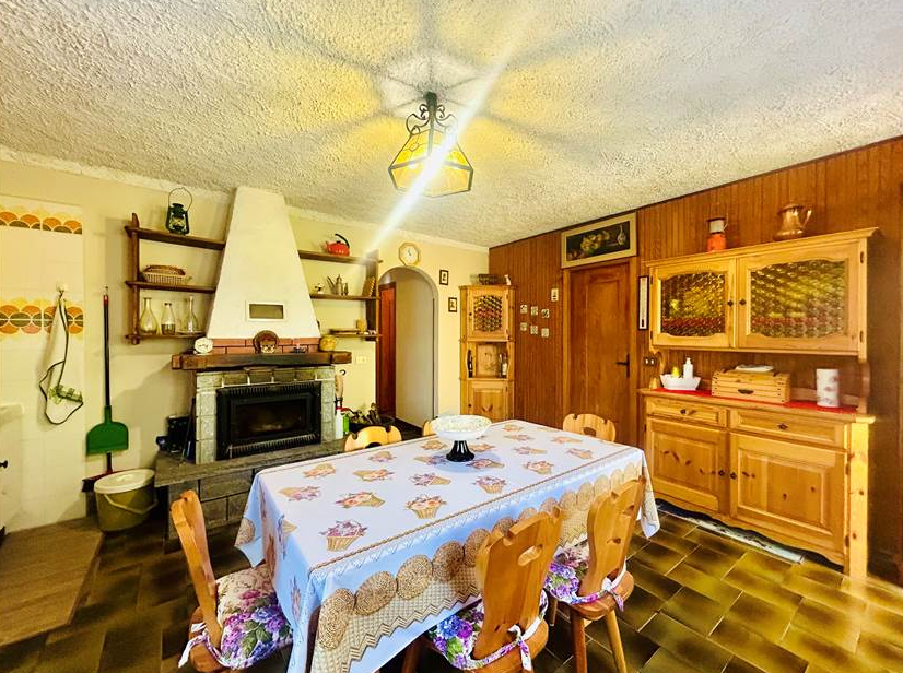 Detached villa with surrounding land.