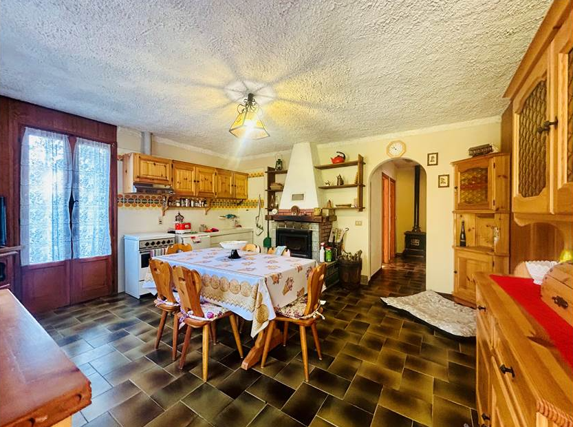 Detached villa with surrounding land.