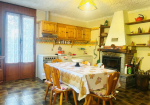 Detached villa with surrounding land.