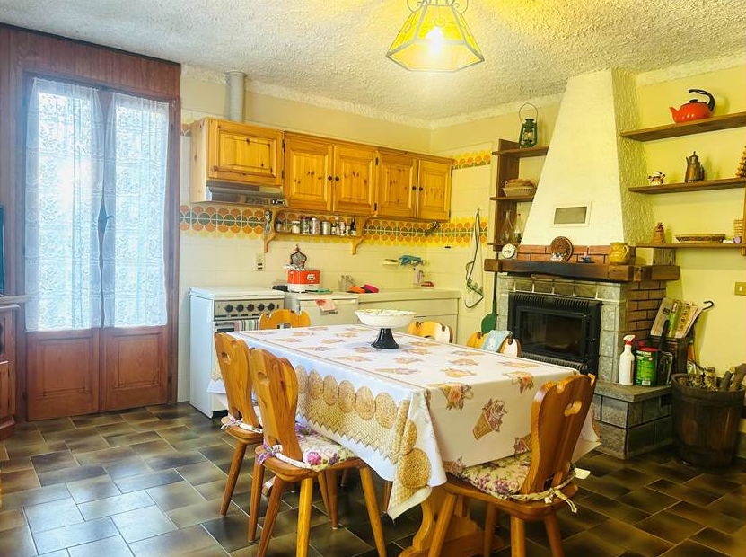 Detached villa with surrounding land.