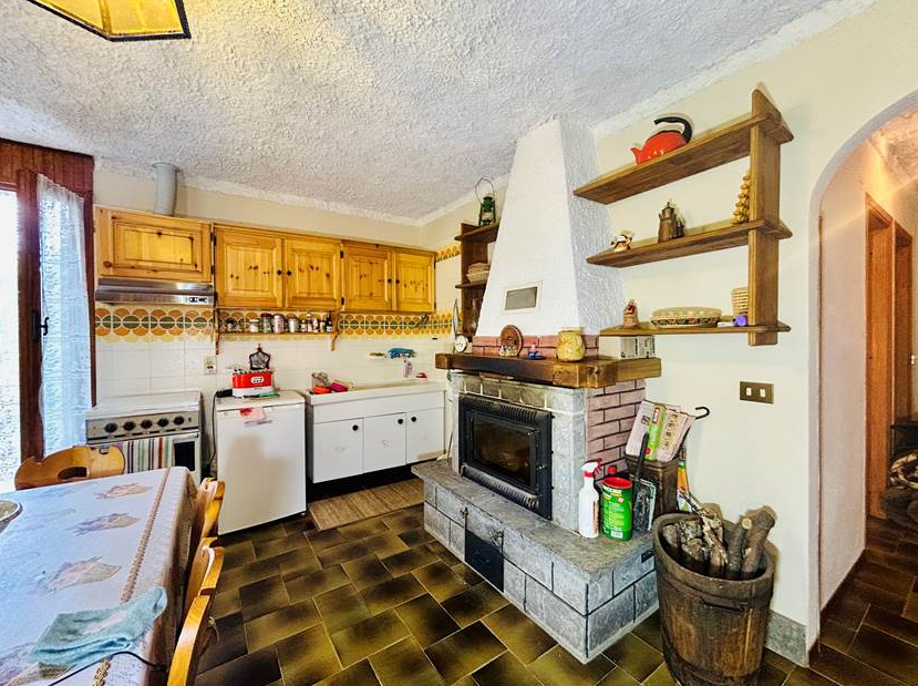 Detached villa with surrounding land.