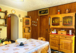 Detached villa with surrounding land.