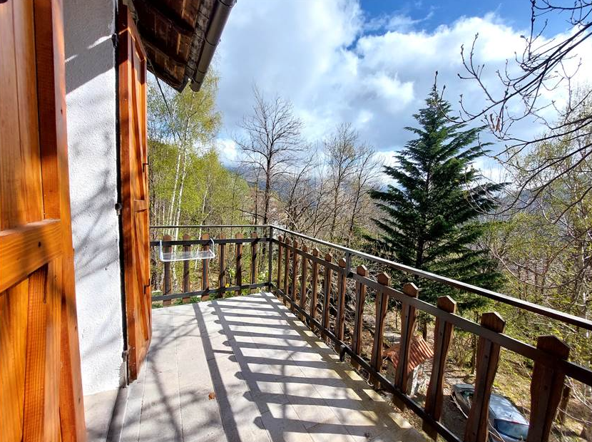 Detached villa with surrounding land.