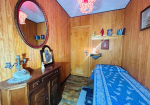 Detached villa with surrounding land.