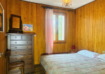Detached villa with surrounding land.