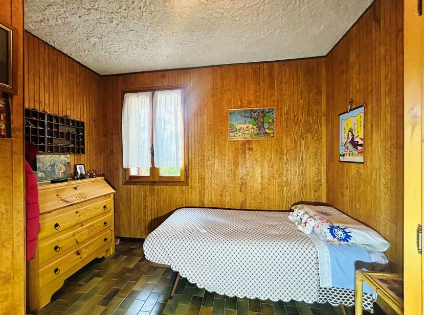 Detached villa with surrounding land.