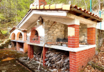 Detached villa with surrounding land.