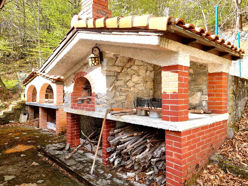 Detached villa with surrounding land.