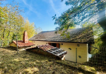 Detached villa with surrounding land.