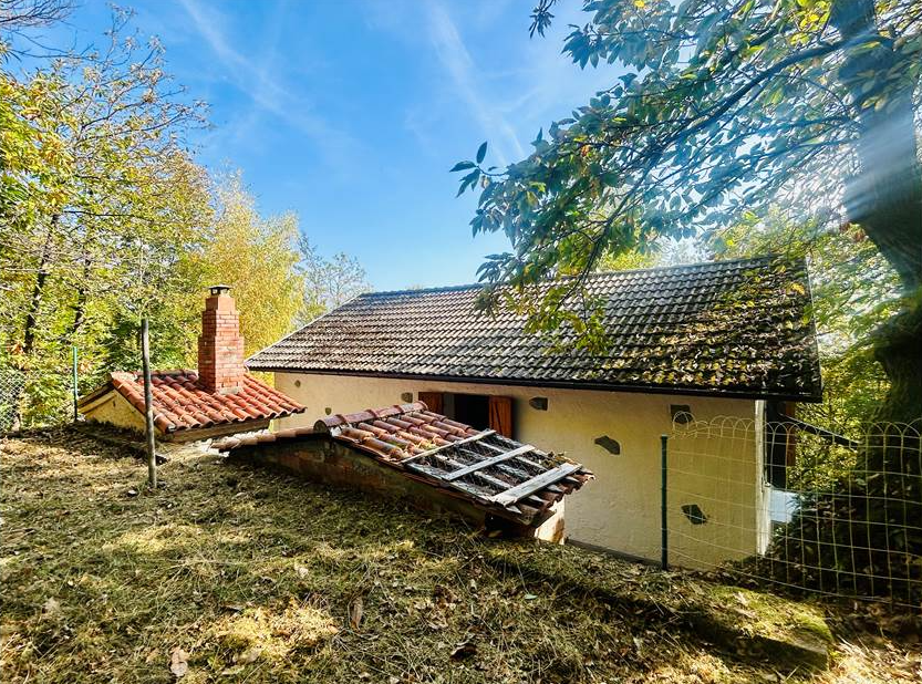Detached villa with surrounding land.