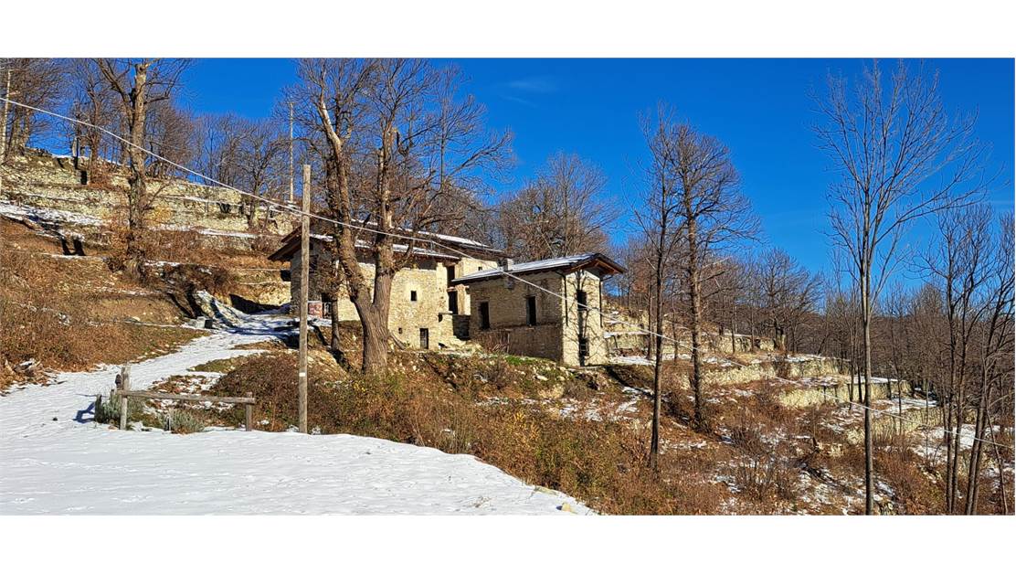 Three rustic stone house sourraunding by 7500 sqm of private land