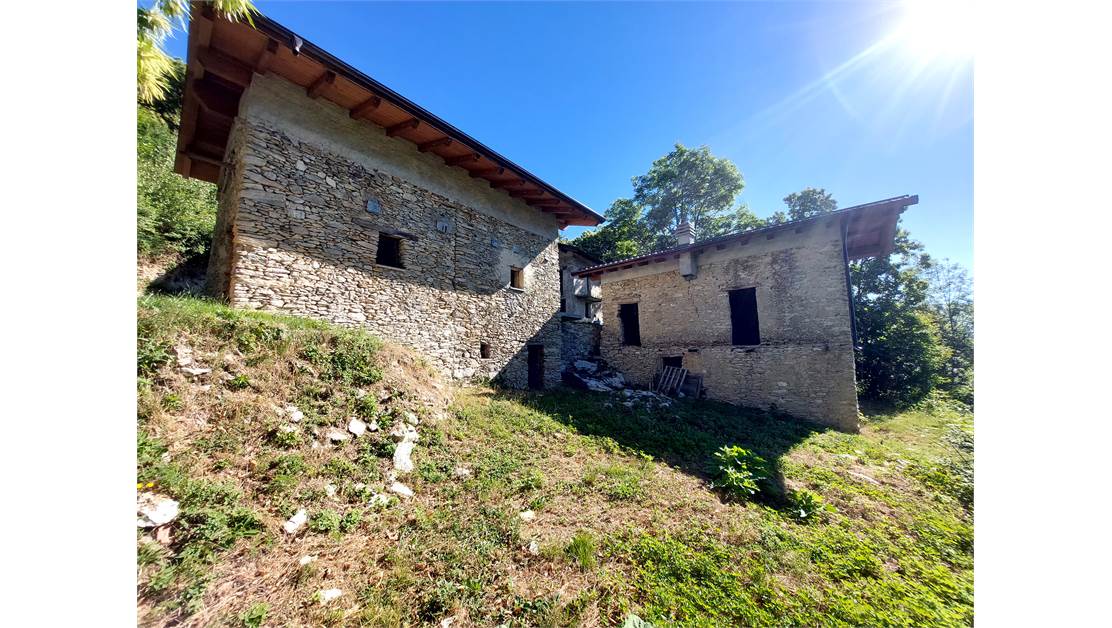 Three rustic stone house sourraunding by 7500 sqm of private land