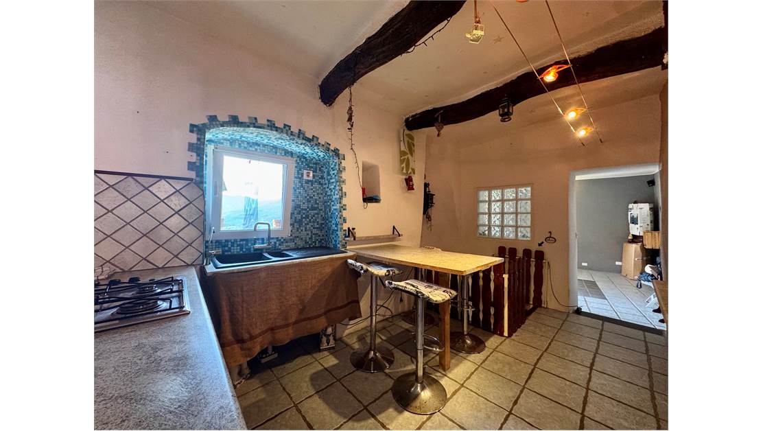 Two-level village house with storage room and land