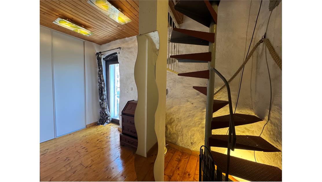 Two-level village house with storage room and land