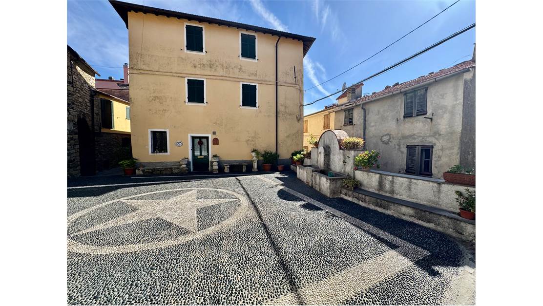 Two-level village house with storage room and land